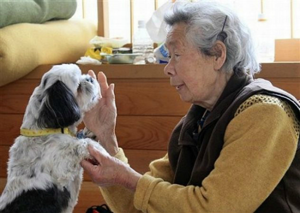 elderly woman with her pet dog