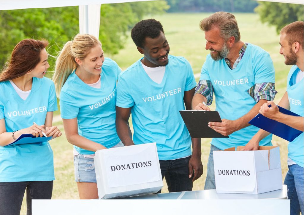 Group of volunteers dressed in light blue t-shirts