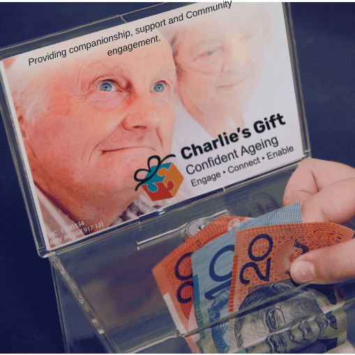 donation being placed in a Charlie's gift donation box
